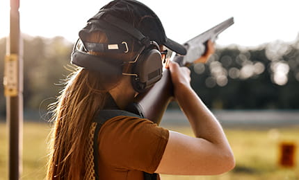 A woman sport clay shooting.