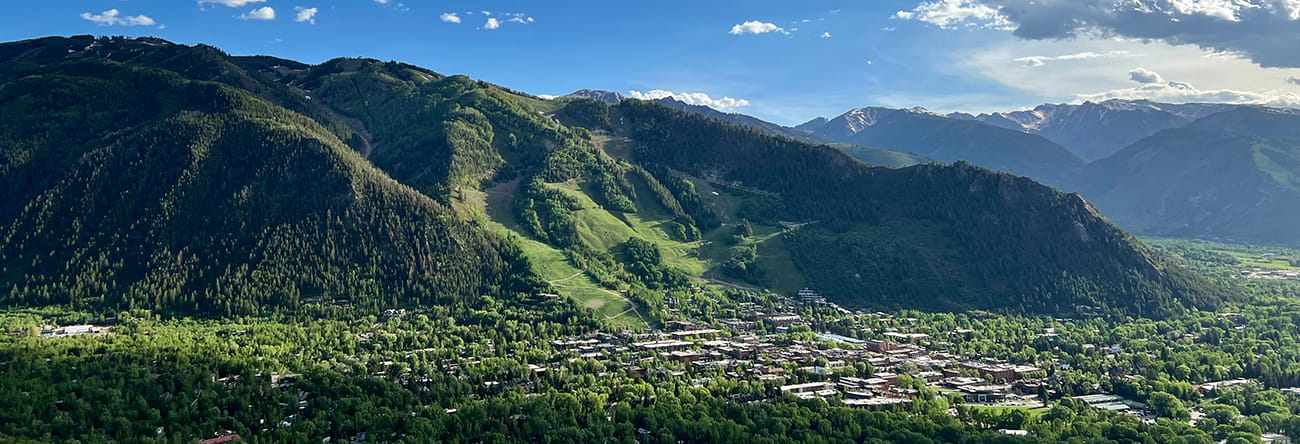 The town of Aspen nestled at the base of Aspen Mountain in the summer.