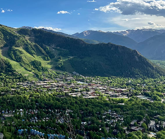 The town of Aspen nestled at the base of Aspen Mountain in the summer.
