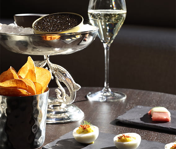 Caviar, potato chips, deviled eggs, and champagne in The Wine Bar.
