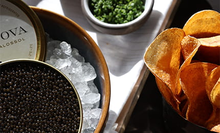 Caviar, potato chips, and chives.