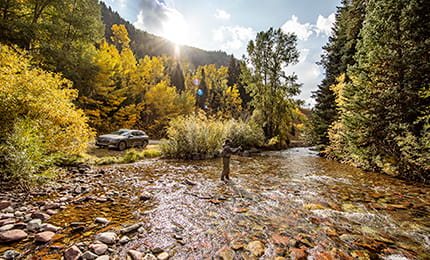 A guest of The Little Nell goes on a fly fishing trip during the fall.