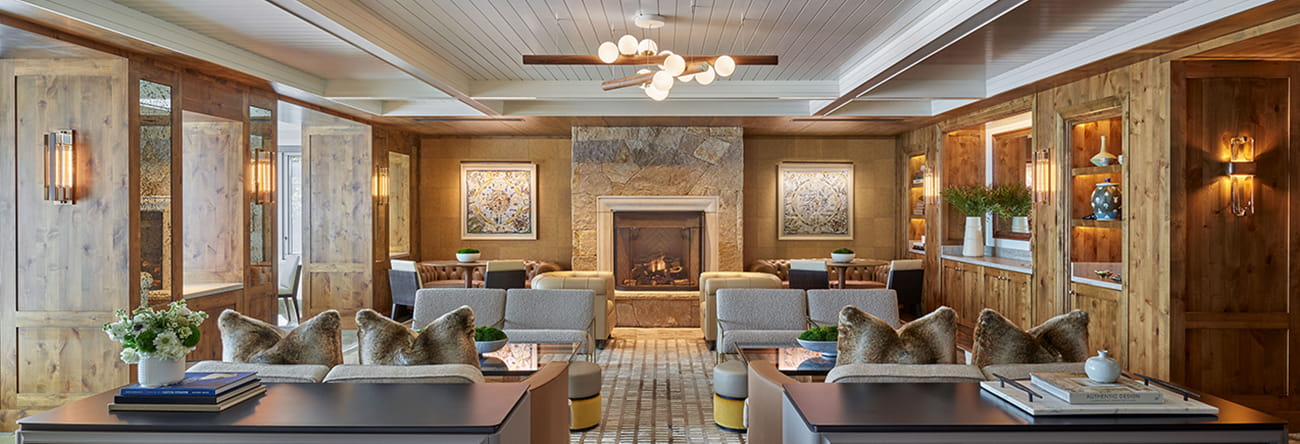 The owner's lounge at The Residences with multiple couches and a fireplace