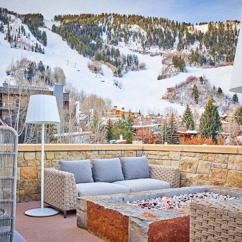 outdoor terrace with seating overlooking mountains