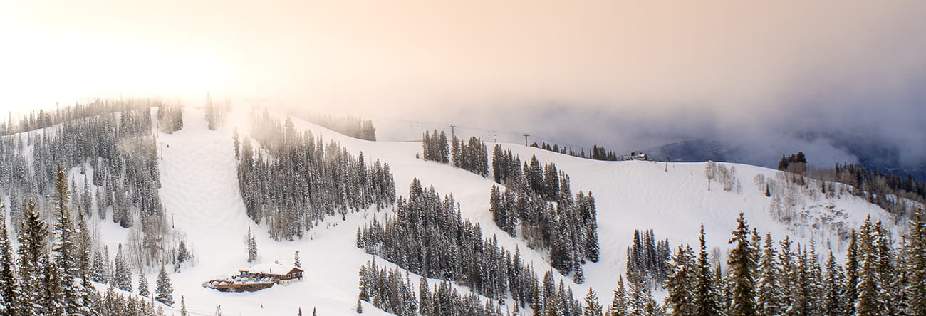 Gondolas above Aspen Mountain at sunrise.