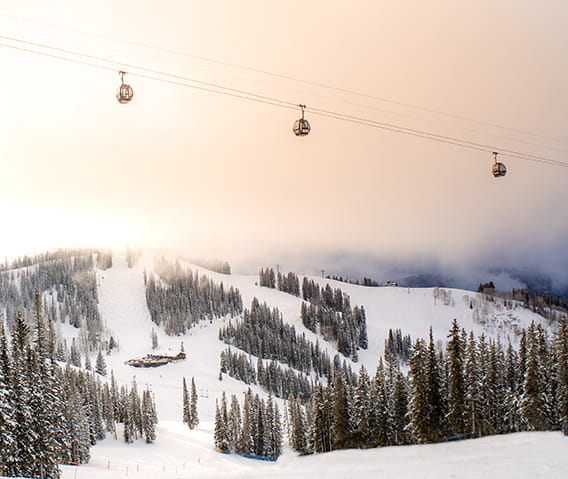 Gondolas above Aspen Mountain at sunrise.