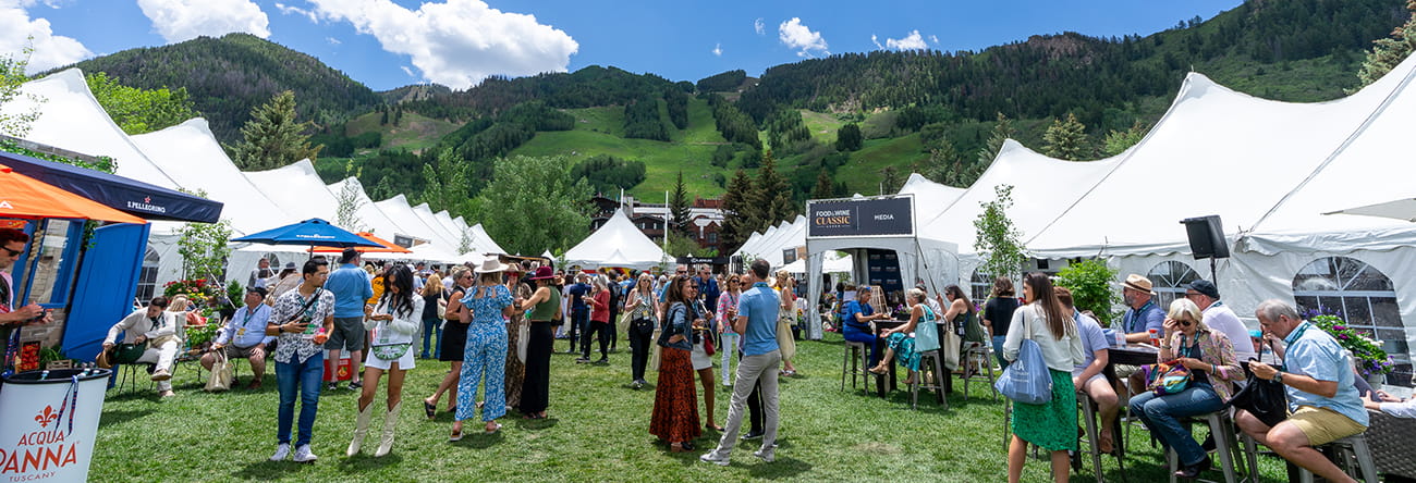 People walking around inside the Food & Wine in Aspen Grand Pavilion.