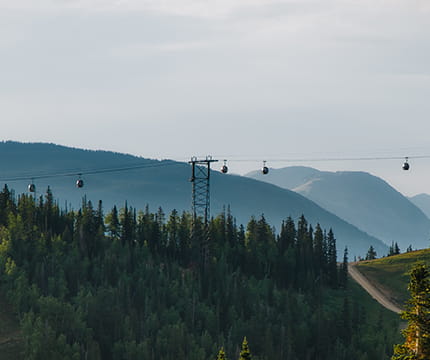 Gondolas in the horizon on Aspen Mountain