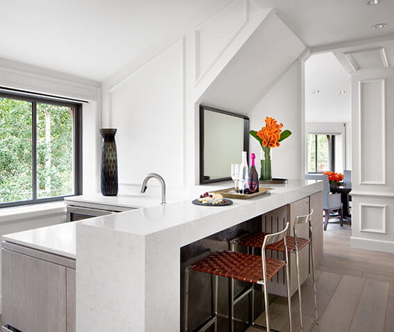 A bar with wine and cheese inside the Paepcke Suite at The Little Nell.