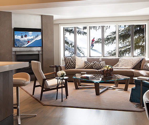 The Pfeifer Suite's lush living room and view of Aspen Mountain.