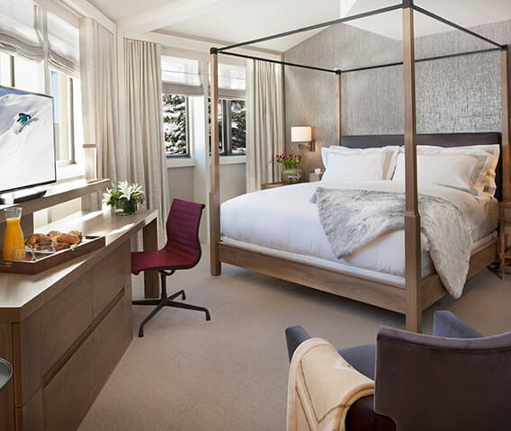 The Pfeifer suite's master bedroom featuring a king-sized bed and flatscreen.