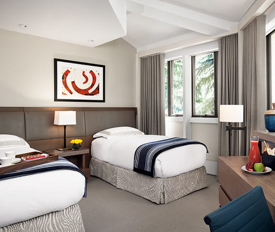 Two twin beds in the second bedroom of the Pfeifer Suite at The Little Nell in Aspen.