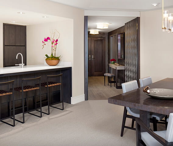 The Iselin Suite's fully stocked bar and spacious entryway.