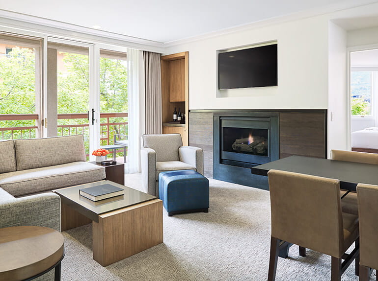 a living room with a fireplace and a tv