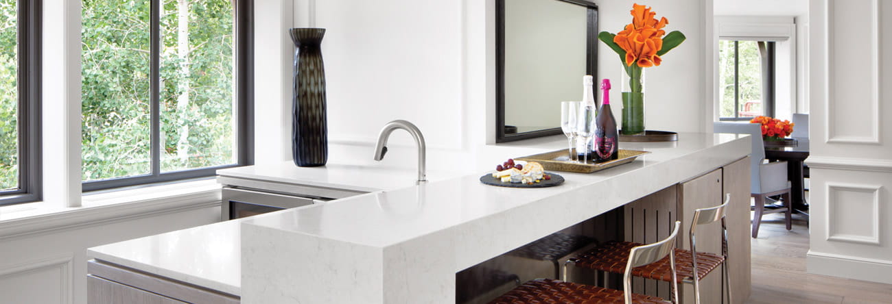 A bar with wine and cheese inside the Paepcke Suite at The Little Nell.