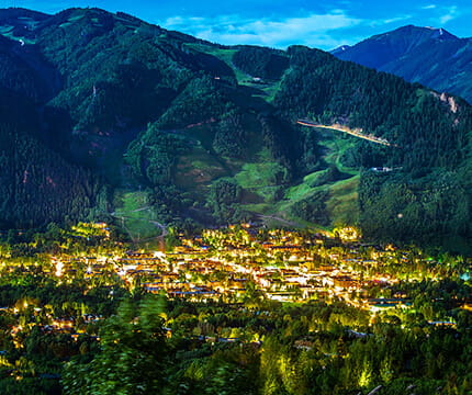 View of Aspen Mountian behind the town of Aspen lit up at night