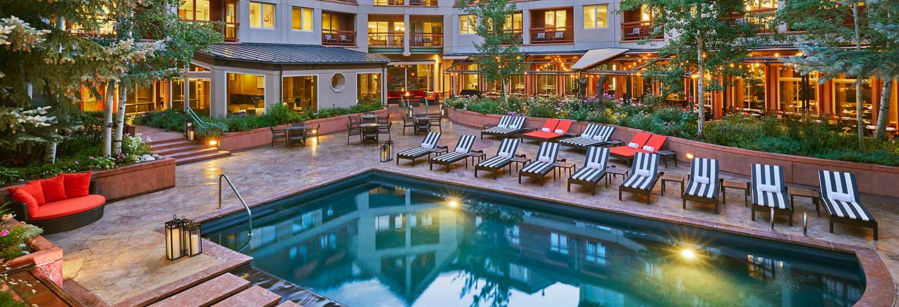 A heated pool and hot tub at a luxury 5 star hotel in Aspen.