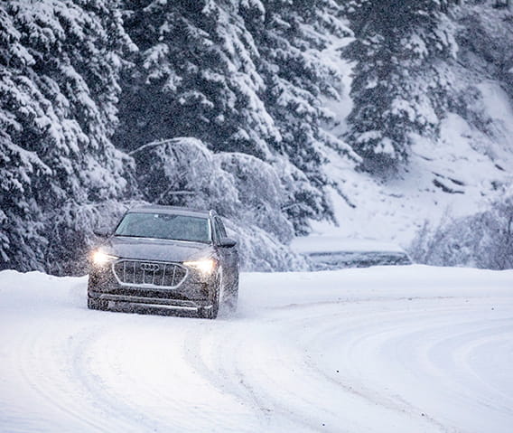 A guest test drives an Audi in Aspen with The Little Nell's Audi Experience.
