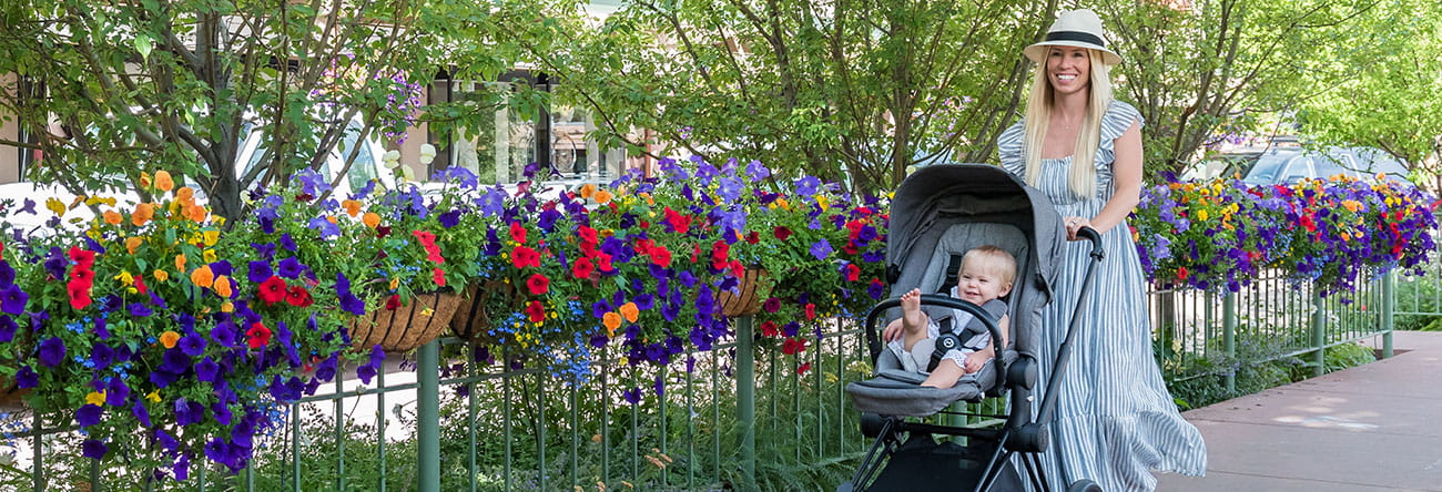 mother pushing stroller in aspen