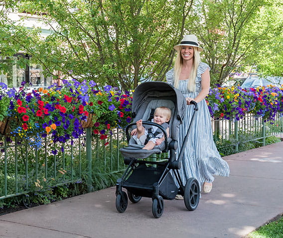 mother pushing stroller in aspen