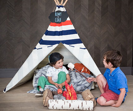 Children play in a tent as part of family amenities offered at The Little Nell in Aspen.