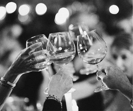people toasting wine glasses