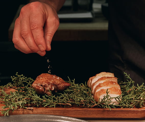 chef plating food in element 47