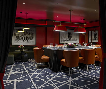 The Board Room, a hidden speakeasy private room set for dinner.