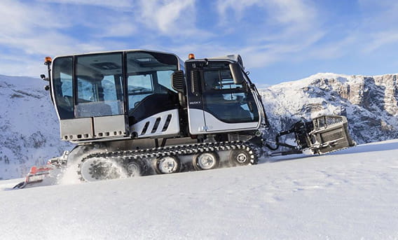A snowcat climbing up Aspen Mountain to create fresh tracks for skiers.