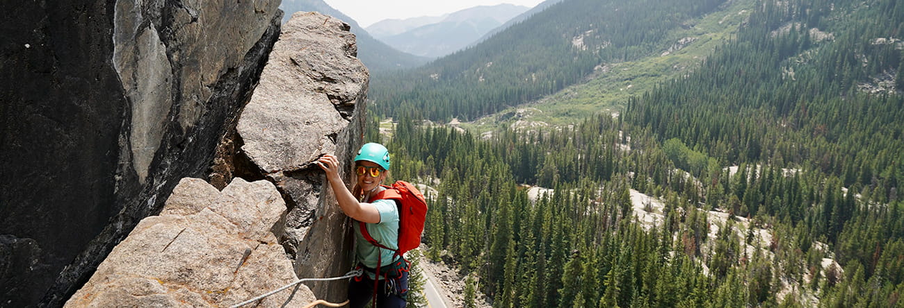 A woman rock climbing on Independence pass.