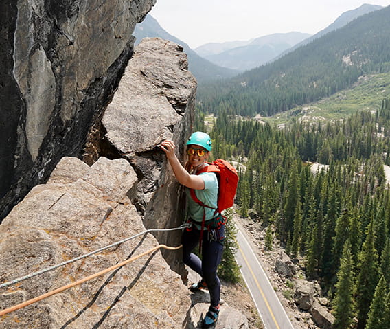 A woman rock climbing on Independence pass.