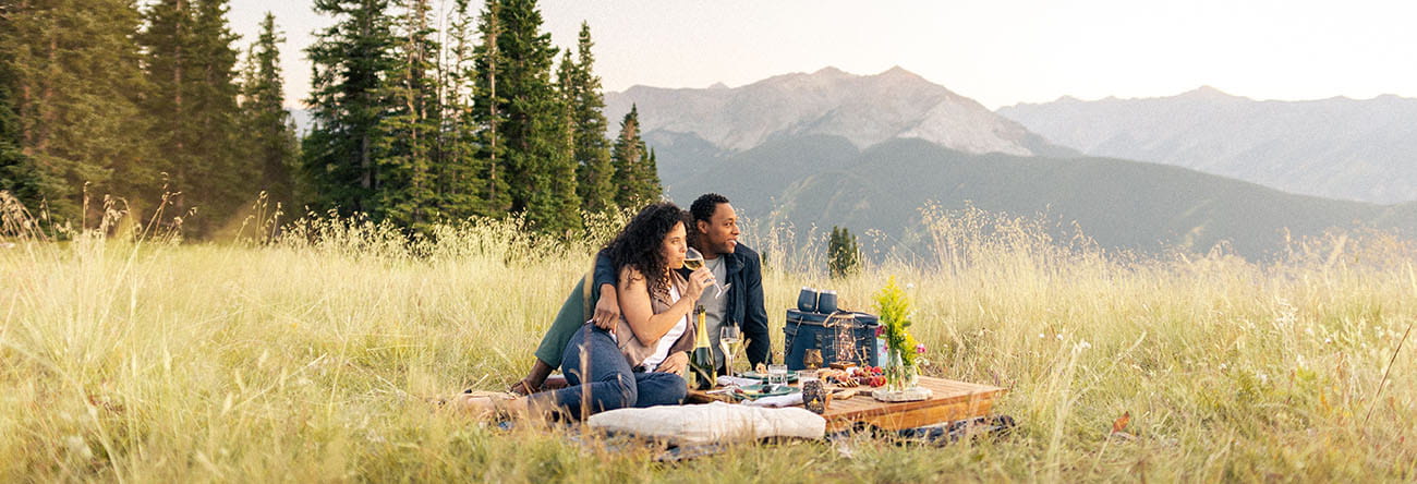 Couple picnicking on Aspen Mountain in the summer 