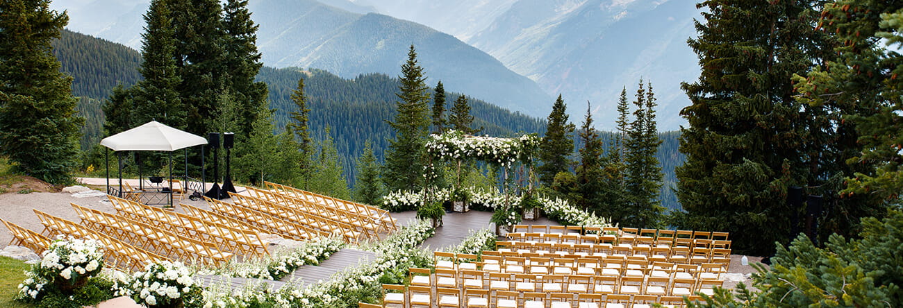 The Aspen Mountain Wedding Deck is The Little Nell's premier wedding venue, offering stunning mountain views for a private, serene wedding ceremony.