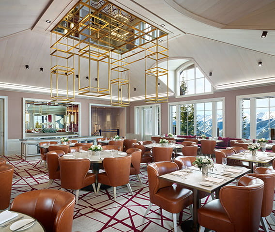 The ASPENX Mountain Club venue with a dining room and mountain views.