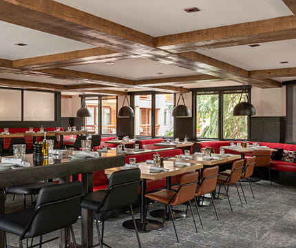 Empty Aspen, Colorado restaurant with table settings.