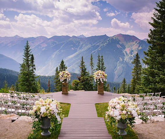 The Aspen Mountain Wedding Deck is The Little Nell's premier summer wedding ceremony venue, offering stunning views of the Elk Mountain Range.