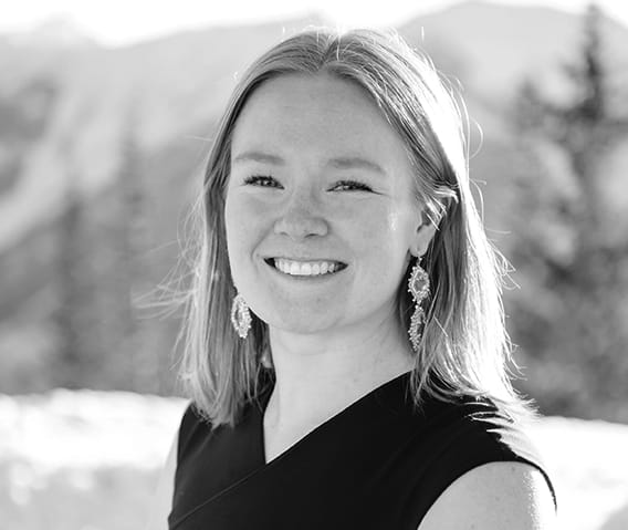 Events Manager, Reilly Bawcom a top of Aspen Mountain in the winter.