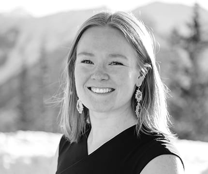 Events Manager, Reilly Bawcom a top of Aspen Mountain in the winter.