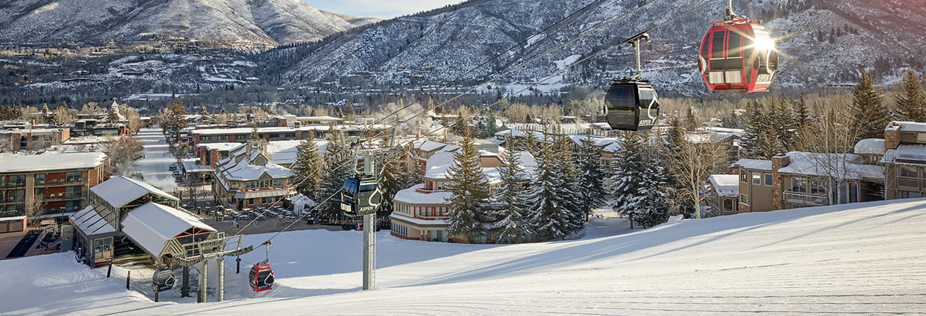 The Silver Queen Gondola and The Little Nell hotel on a sunny winter day.