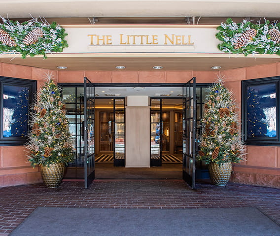 The Little Nell front entrance with festive winter decor.