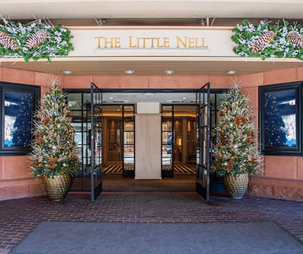 The Little Nell front entrance with festive winter decor.