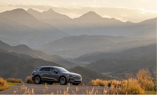 audi car in front of mountains in the fall