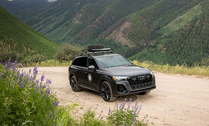 audi driving on mountain road
