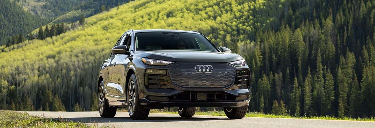 audi suv in front of mountains