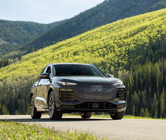 audi suv in front of mountains