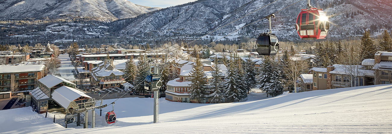 The Little Nell hotel at the base of Aspen Mountain in the winter on a sunny day