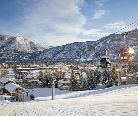 The Little Nell hotel at the base of Aspen Mountain in the winter on a sunny day