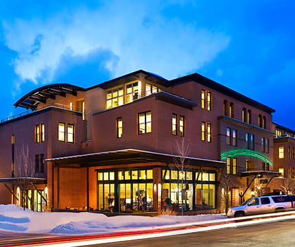 The Limelight Aspen Hotel in the winter at dusk