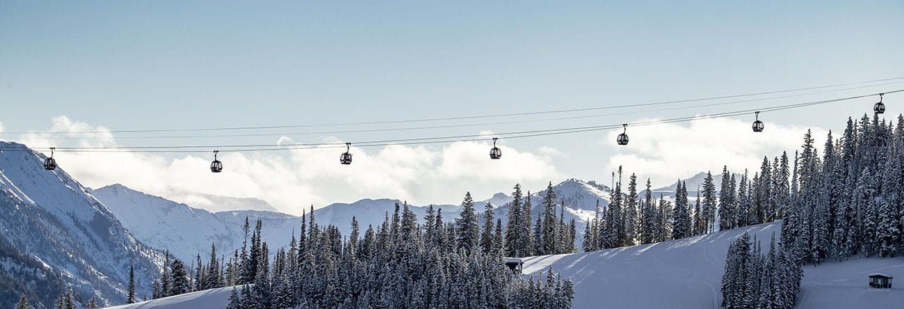 gondola over aspen mountains and snow