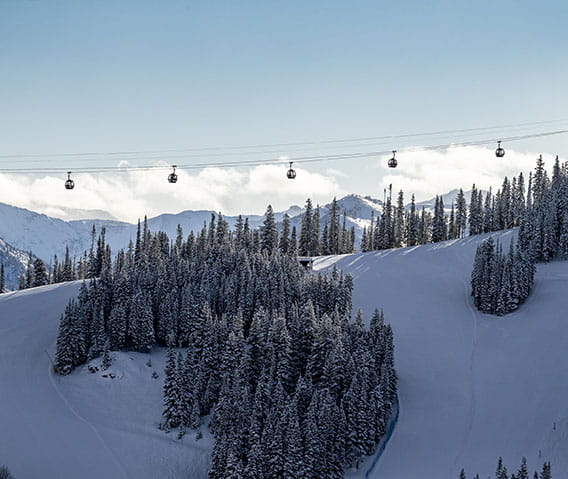 gondola over aspen mountains and snow